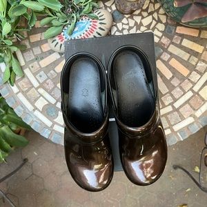 Brown patent leather Dansko clogs